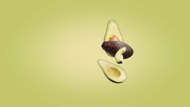 Avocado halves and slices that fall on a Yellow Green background.