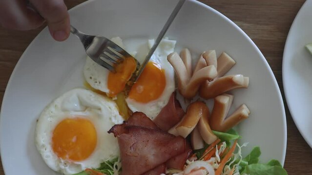 English breakfast - eggs, bacon and vegetables with juice