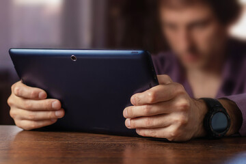 close up hands multitasking man using tablet, laptop and cellphone connecting wifi
