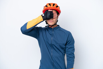 Young cyclist caucasian man isolated on white background covering eyes by hands. Do not want to see something