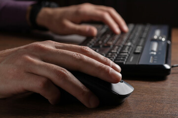 Human hand on computer mouse. Business, education, people and technology concept