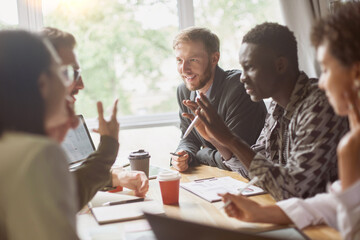 young entrepreneurs discussing a joint project in the office of the coworking center.