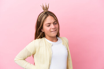 Little princess with crown isolated on pink background suffering from backache for having made an effort