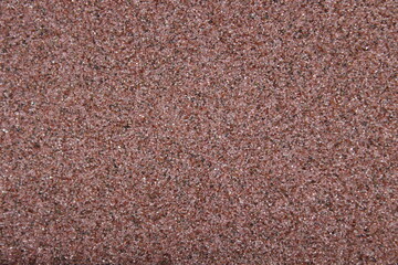 Fine abrasive sand. Macro.