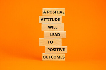 Think positive symbol. Wood blocks with words A positive attitude will come to positive outcomes....