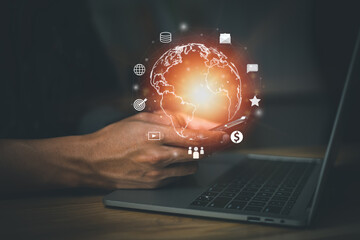 Internet of Things (IoT). Wireless connectivity and communication, information technology networks, financial transactions, social, Messages and Email. Man using smartphone with laptop in office.