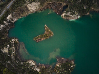 Aerial drone view Basalt columns Amazing industrial landscape, on Emerald lake in a flooded quarry,...