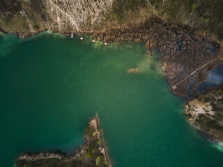 Aerial drone view Basalt columns Amazing industrial landscape, on Emerald lake in a flooded quarry,...