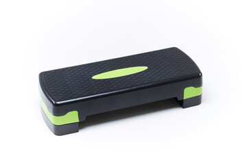 black and green stepped platform. Aerobic stepper on a white background. Aerobic step for fitness...