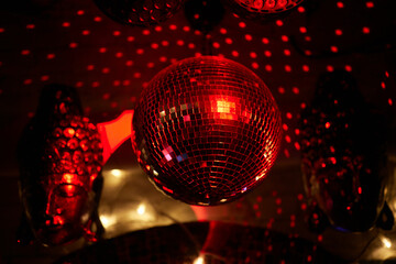 Colorful disco mirror ball lights night club background. Party lights disco ball. Selective focus.