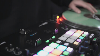 Click colored squares on mixer panel. ART. Hands in dark room are dialing code from multi-colored squares. Abstract music on mixer color board