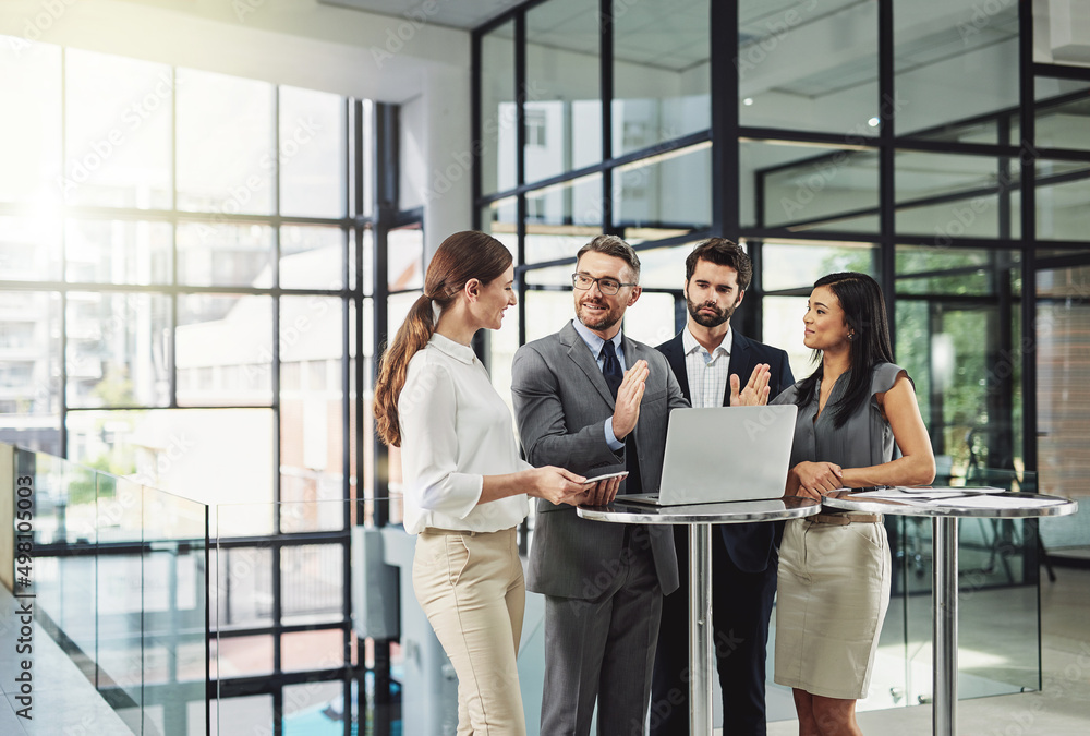 Poster teamwork is the quickest way to success. shot of a group of colleagues discussing business in the of