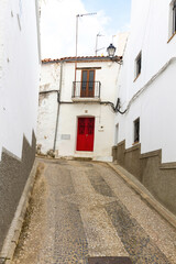 Cobbled street and houses in the town of Aroche, Huelva province 