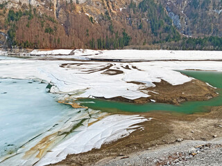 The confluence of the alpine stream Sulzbach into the accumulation lake Klöntalersee...