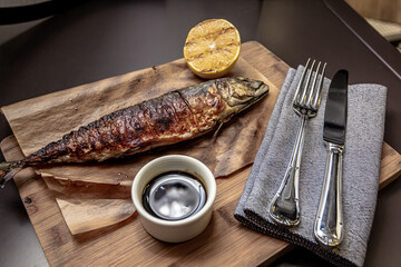Grilled mackerel fish with lemon and sauce