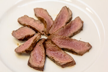 Roast beef steak cut into slices