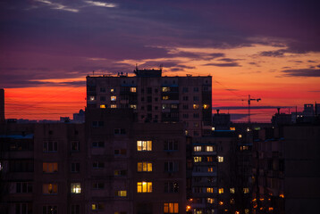 Residential apartment buildings against the background of the evening sky. Soviet panel dilapidated...