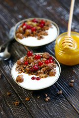 Healthy breakfast. Chocolate crunches with yogurt, honey and berries.