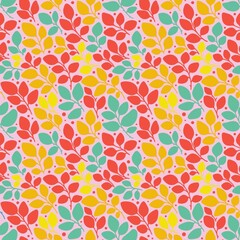 Colorful seamless pattern with orange, green and red leaves on the light pink background
