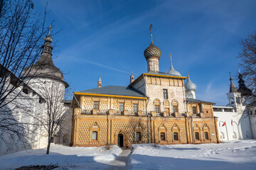 Beautiful church with domes against the blue sky. Winter sunny day. Colorful light. Ancient architecture. Cross on domes.