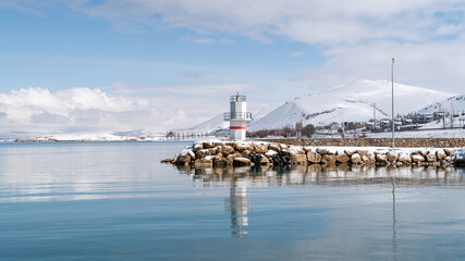Small lighthouse at Lake of Van with snow and winter landscape, Van, Turkey