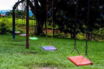 Empty colorful swings at the park