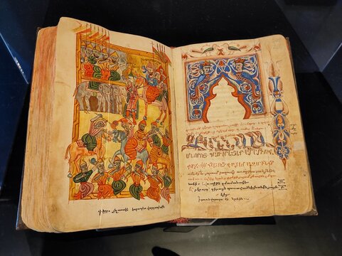 Dubai, UAE- March 31 2022: Colorful pages of the old Hebrew Bible, psalms and the testaments of Jesus Christ. Ancient hand written book of Vatican is now a rare antique. 