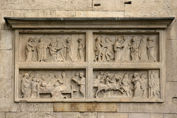 Close up of sculptures on the facade of the cathedral of Modena, Italy.