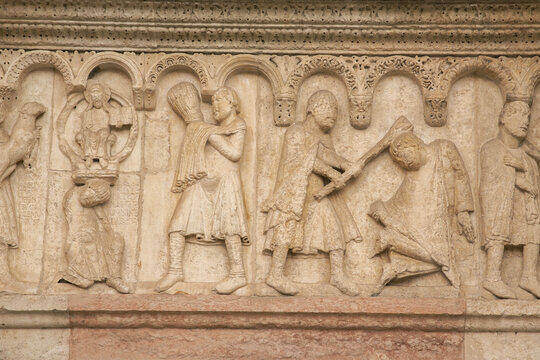 Close up of sculptures on the facade of the cathedral of Modena, Italy.