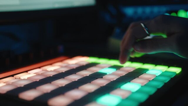 Music producer working on drum controller 