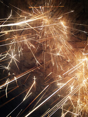 Bright sparks bouncing off a flat surface