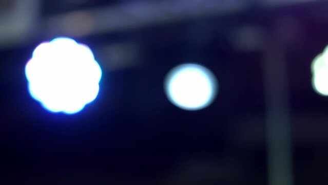 color performance, illuminator on stage, bright rays