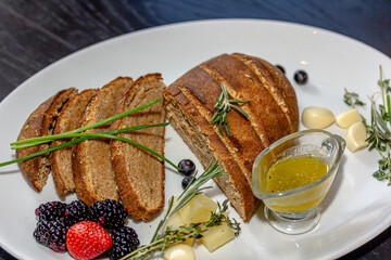 Rye bread with cheese and honey is on the table