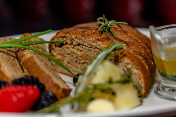 Rye bread with cheese and honey is on the table