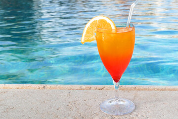Sex on the beach Cocktail near the swimming pool. Delicious beverages. Holiday and relaxtion concept
