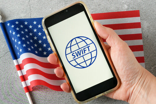 SWIFT Is Society For Worldwide Interbank Financial Telecommunication Network And American Flag, Top View