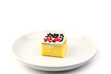 Square cake on white plate