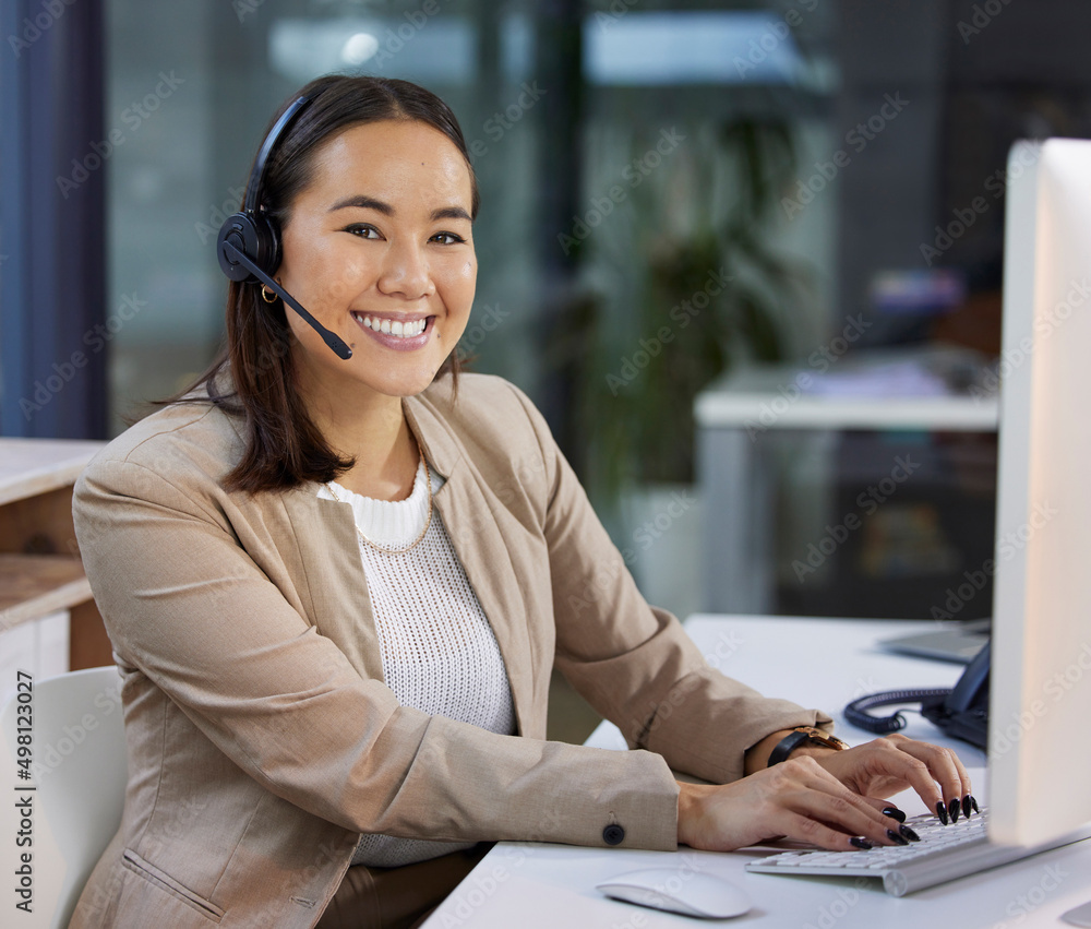 Canvas Prints How can I make your experience a happy one. Portrait of a young woman using a headset and computer in a modern office.