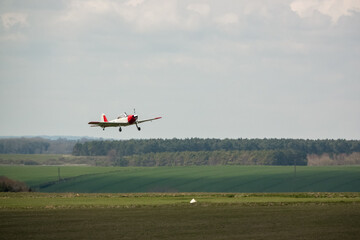 a 1951 De Havilland DHC-1 Chipmunk WD363 22 C-N C1-0304 taking off from a grass runway