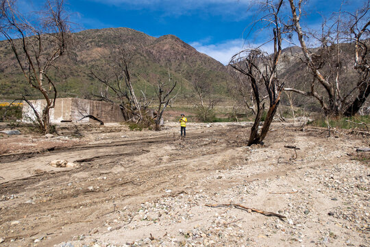 A UAV Drone Pilot Surveying The Aftermath Of A Wildfire