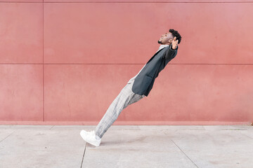 african-american man falling backwards onto concrete floor - obrazy, fototapety, plakaty