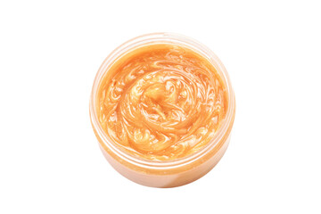 Face scrub smear texture. Cream skincare cosmetic in round jar. Organic stroke. Feet oily cleanser smudge. Particles in gel. White background. Top view. Yellow and black fluid treatment