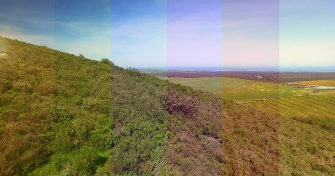 Composite image of transparent striped overlay against aerial view of grassland