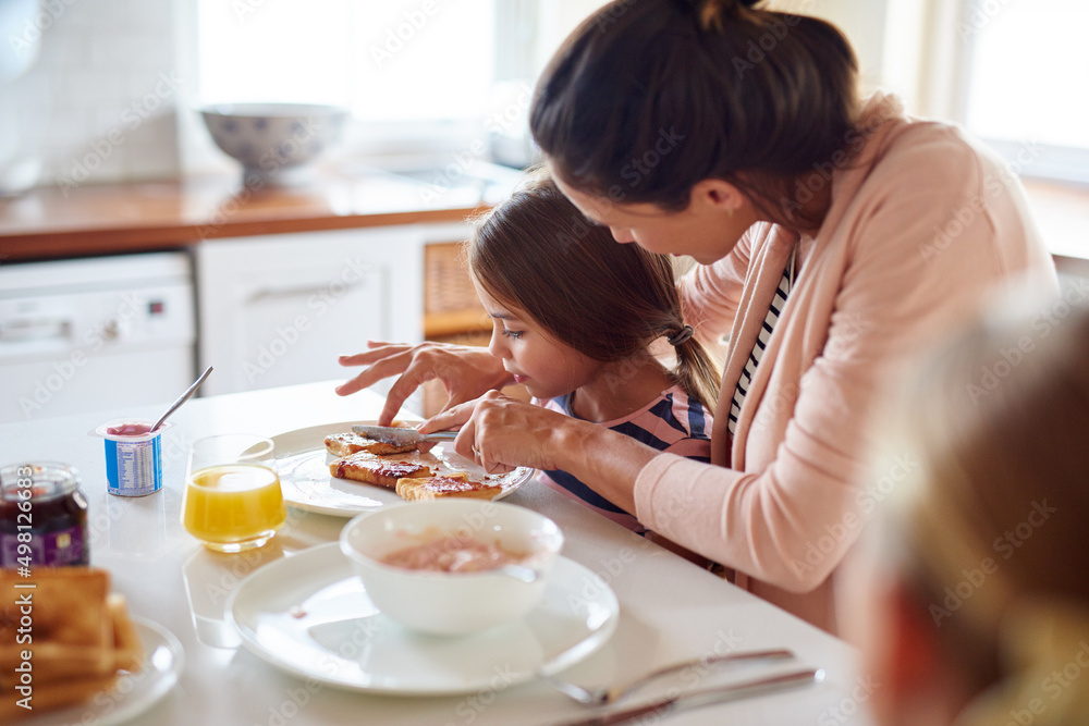 Poster Having fun at the breakfast table. Shot of a family having breakfast together.