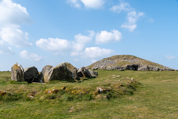 Irish green hill with blue sky near Loughcrew Historic Passage Tomb Relic near Oldcastle, County...