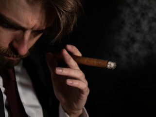 Man in suit smoking cigar