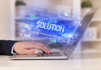 Closeup of businessman hands working on laptop