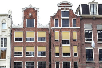 Obraz premium Amsterdam Rokin Street Traditional Brick Building Facades Close Up, Netherlands