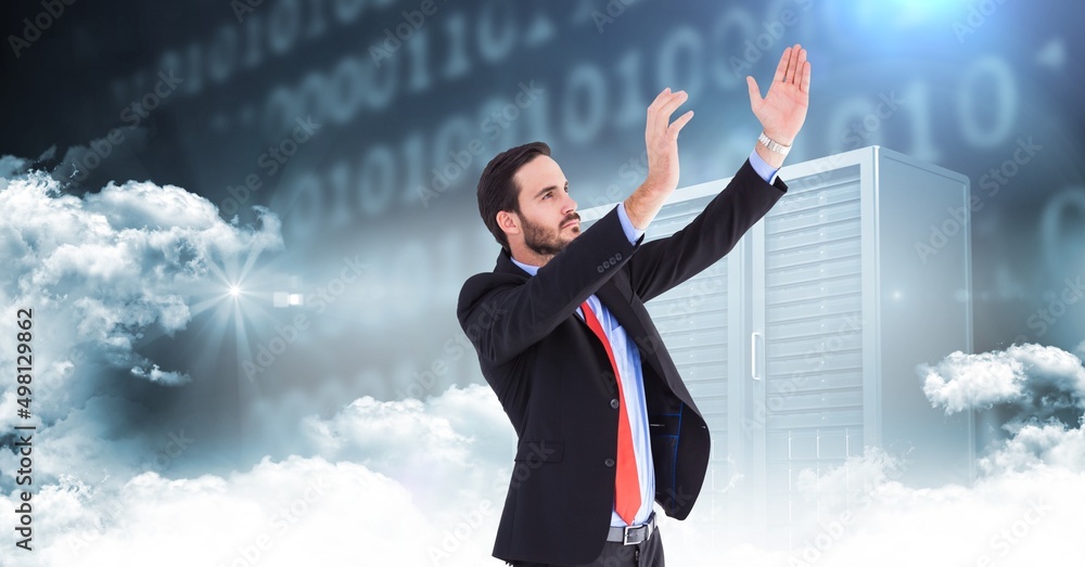 Aufkleber caucasian businessman holding an invisible object against computer servers and clouds in the sky