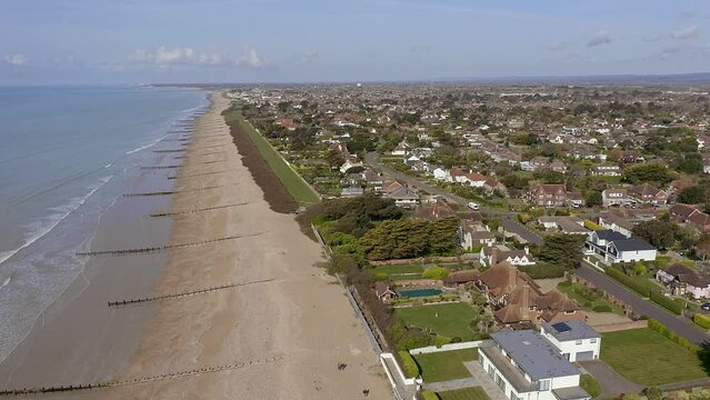 Aerial footage of the seafront near East Preston village in West Sussex looking towards the Willowhayne estate and Rustington.